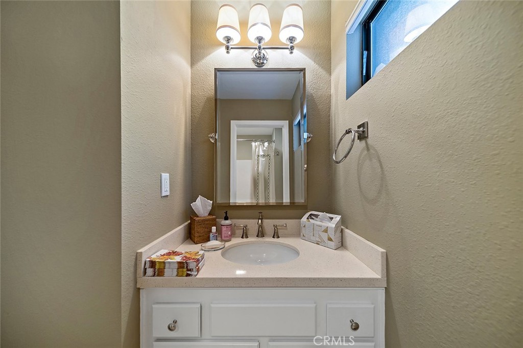 612 Karenken Pines Drive Lake Arrowhead, CA 92391 - Photo 21 of 44 a bathroom with a sink and a mirror