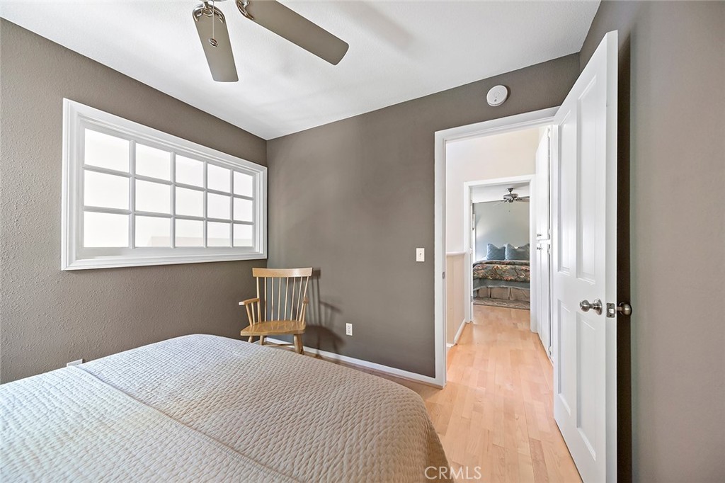 612 Karenken Pines Drive Lake Arrowhead, CA 92391 - Photo 26 of 44 a bedroom with a bed and a window