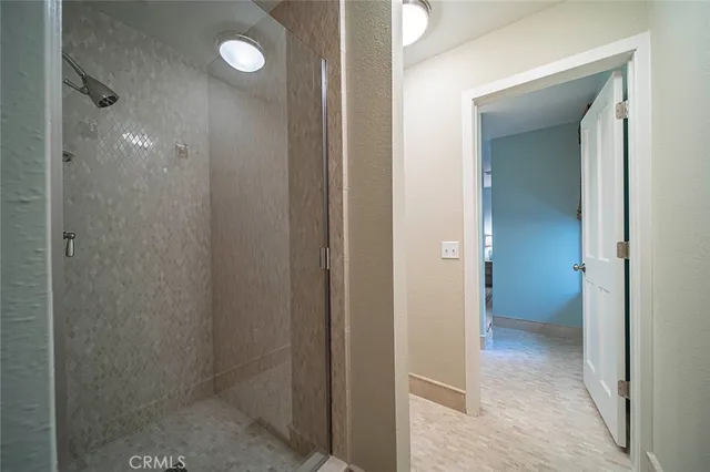 a view of a bathroom from a hallway