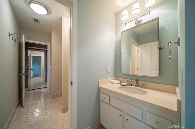 a bathroom with a sink a mirror and a shower