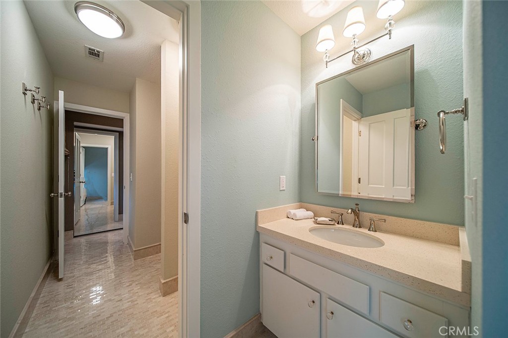 612 Karenken Pines Drive Lake Arrowhead, CA 92391 - Photo 29 of 44 a bathroom with a sink a mirror and a shower