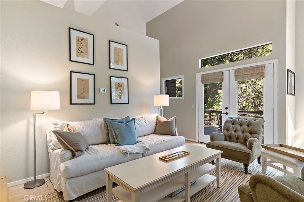 612 Karenken Pines Drive Lake Arrowhead, CA 92391 - Photo 6 of 44 a living room with furniture and a large window
