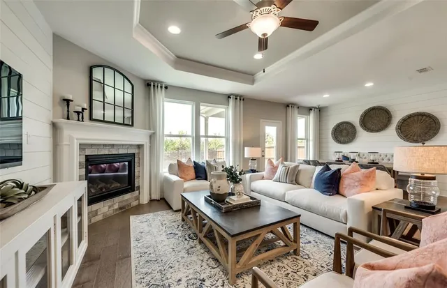 a living room with furniture and a fireplace