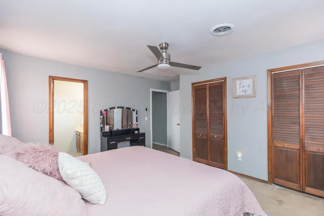 a bedroom with a bed and a dresser