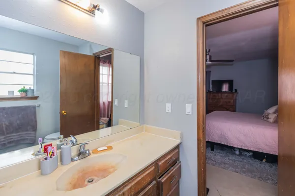 a bedroom with a bed and a dresser