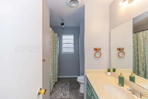 a bathroom with a tub and sink