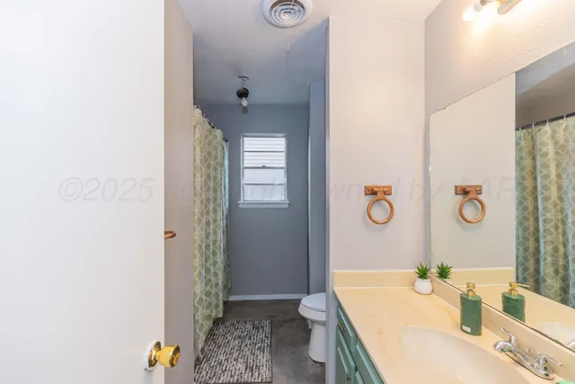 a bathroom with a tub and sink