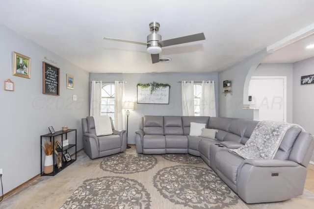 a living room with furniture and a window