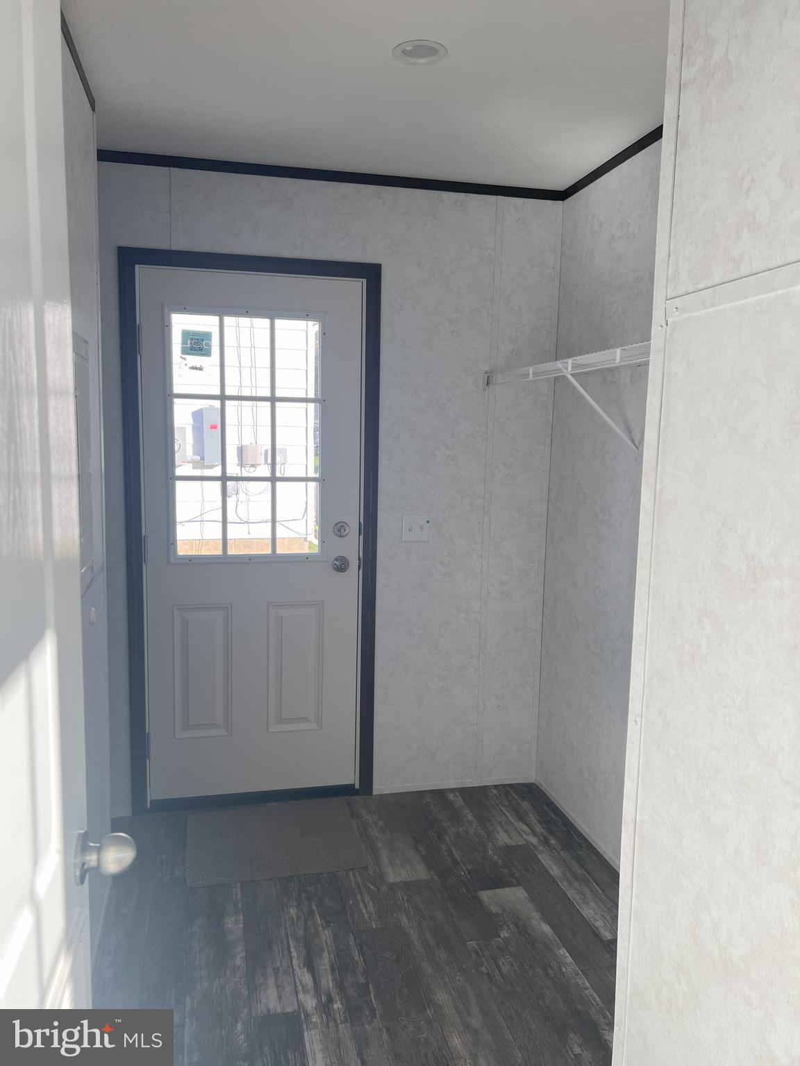 211 Eisenhower Road Moorefield, WV 26836 - Photo 3 of 17 a view of an empty room with a window