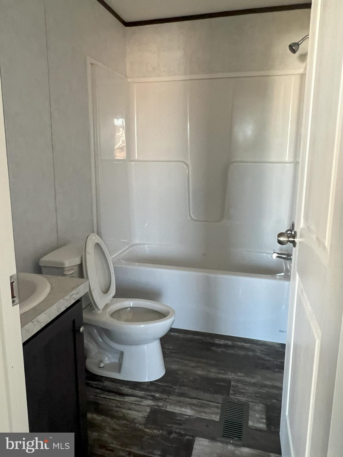 211 Eisenhower Road Moorefield, WV 26836 - Photo 10 of 17 a bathroom with a toilet and a sink