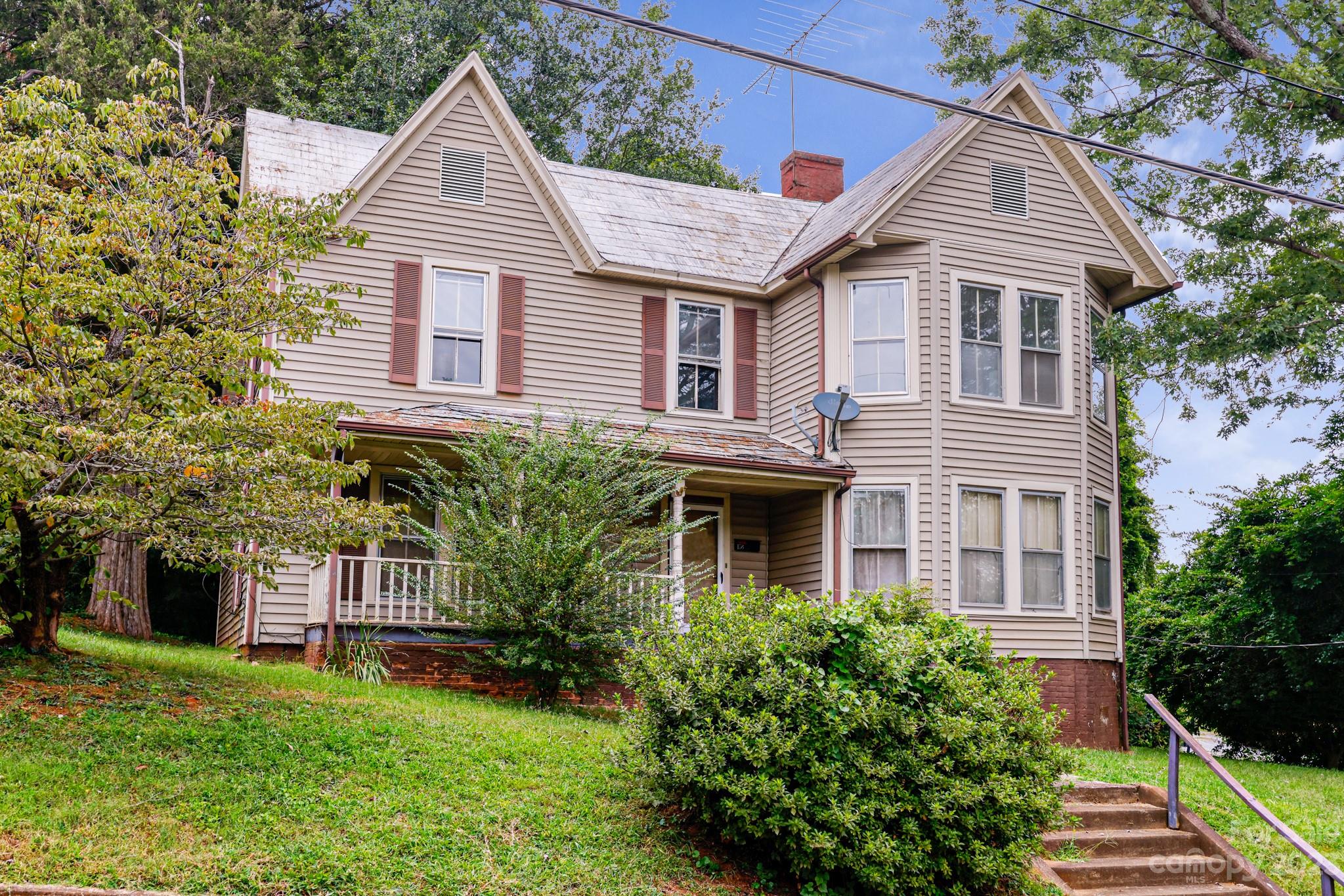 158 Pine Street Rutherfordton, NC 28139 - Photo 1 of 37 a front view of a house with a garden