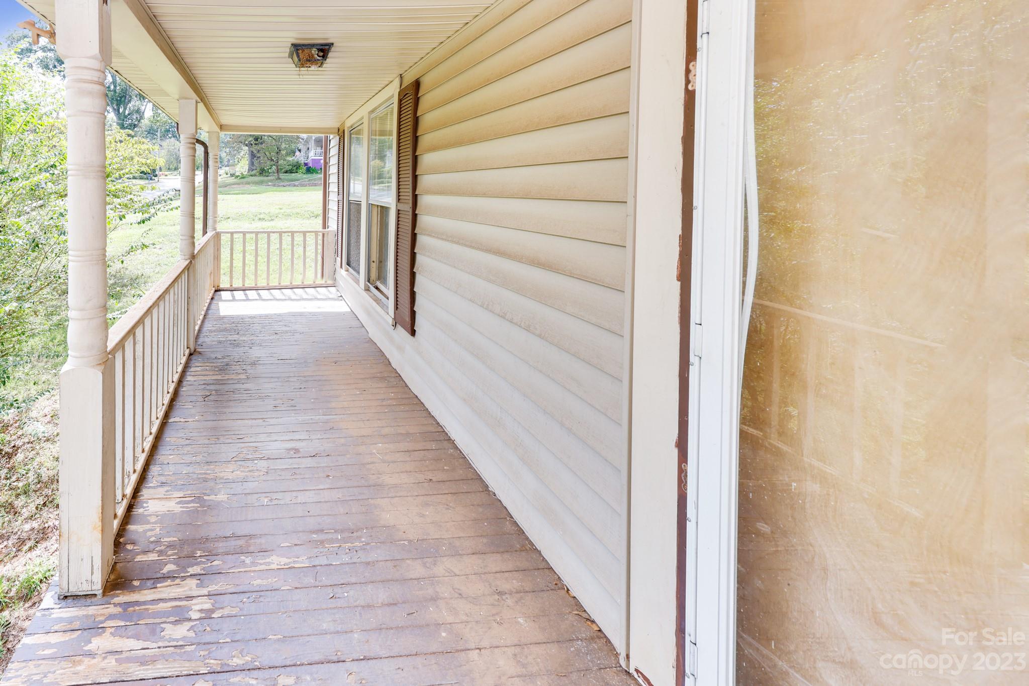 158 Pine Street Rutherfordton, NC 28139 - Photo 34 of 37 a view of a porch with wooden floor and stairs
