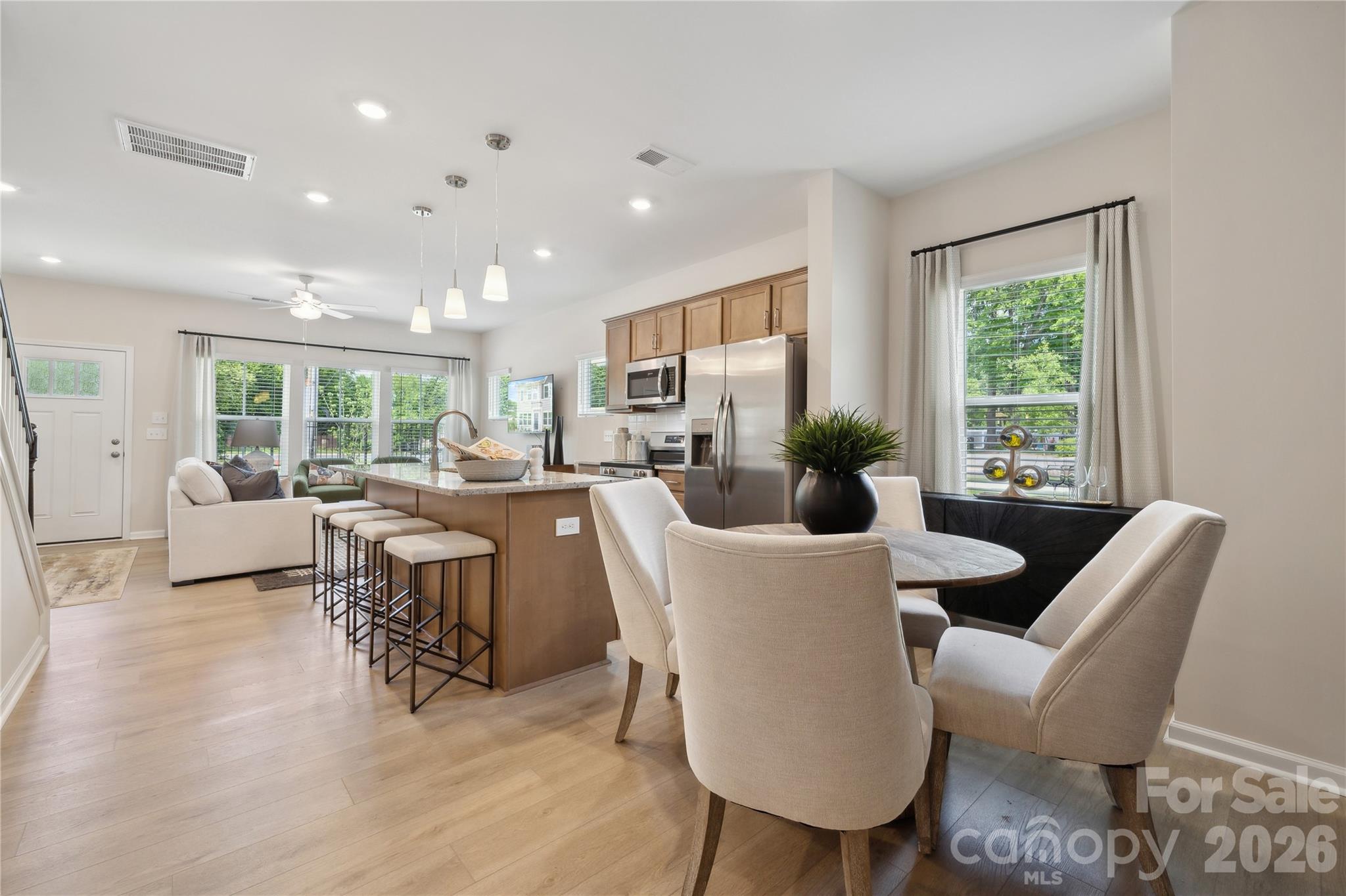 5857 Tuckaseegee Road, Unit 4 Charlotte, NC 28208 - Photo 14 of 23 a living room with furniture potted plant a window and a potted plant