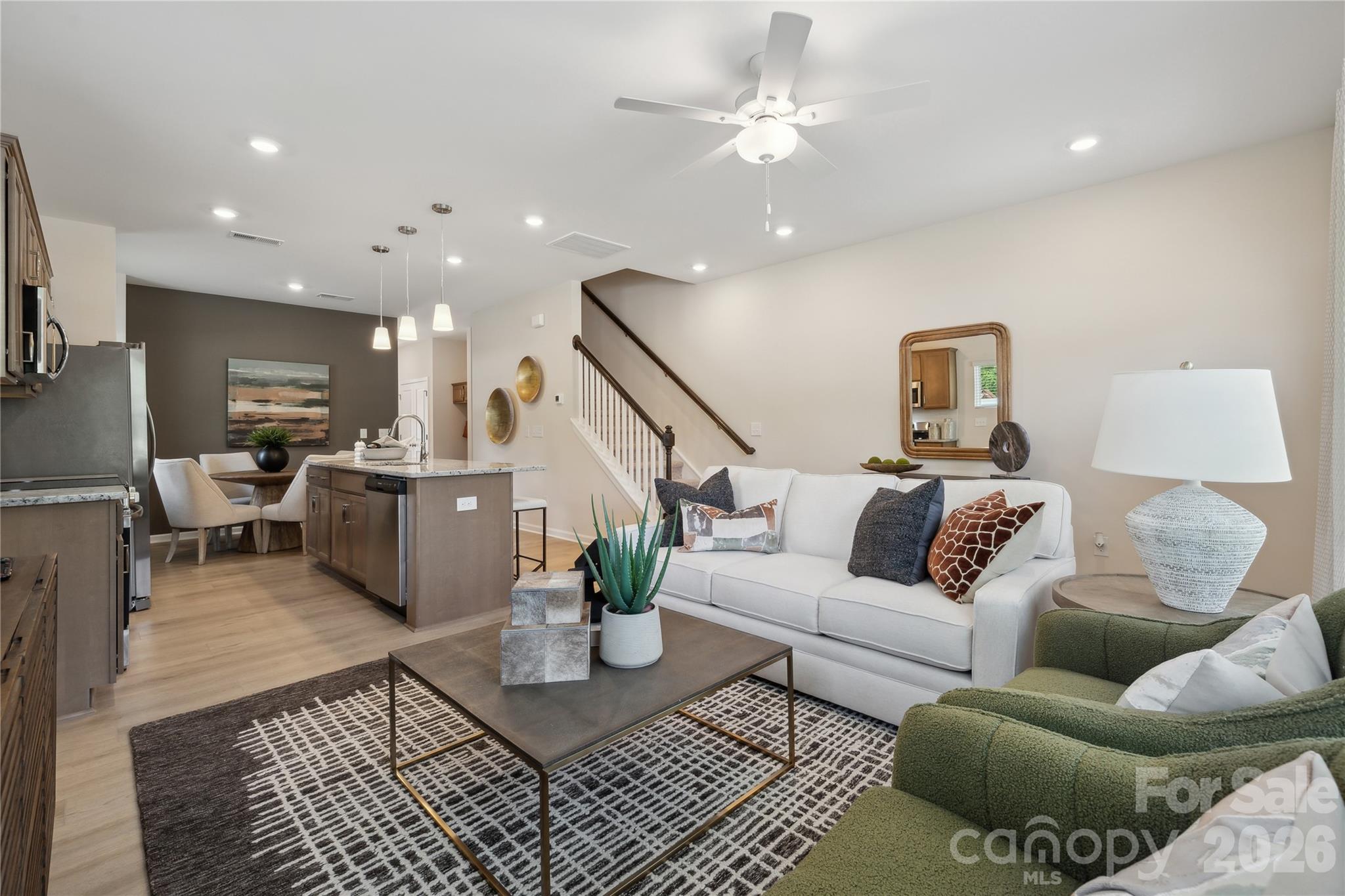 5857 Tuckaseegee Road, Unit 4 Charlotte, NC 28208 - Photo 16 of 23 a living room with furniture and kitchen view