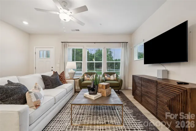 a living room with furniture and a flat screen tv