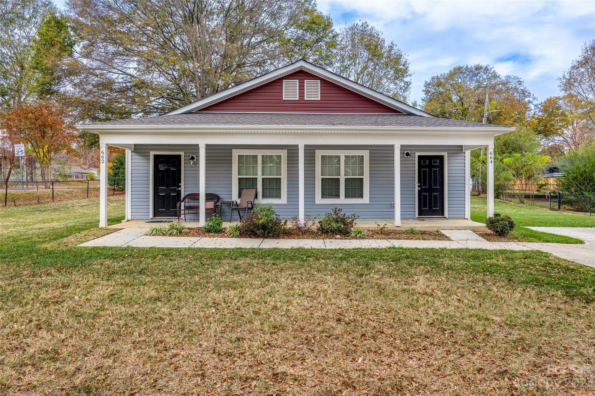 a front view of a house with garden