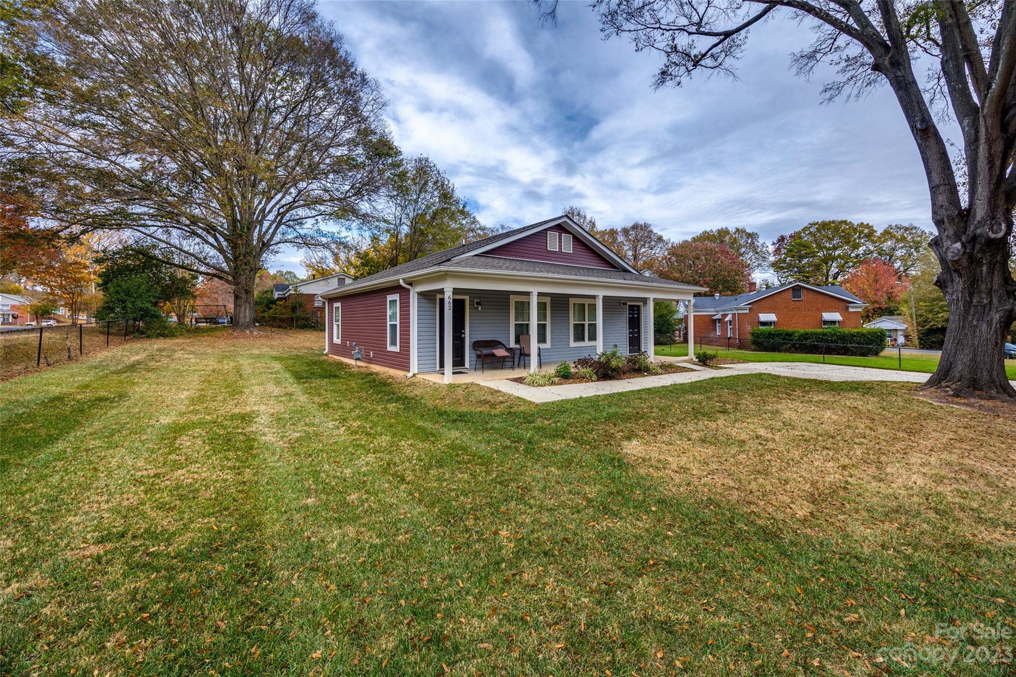 662-664 Reeves Court Charlotte, NC 28208 - Photo 2 of 12 front view of a house with a yard