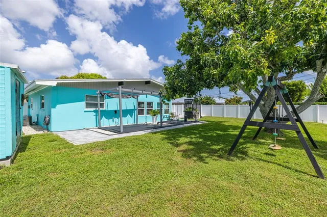 a view of yard with patio
