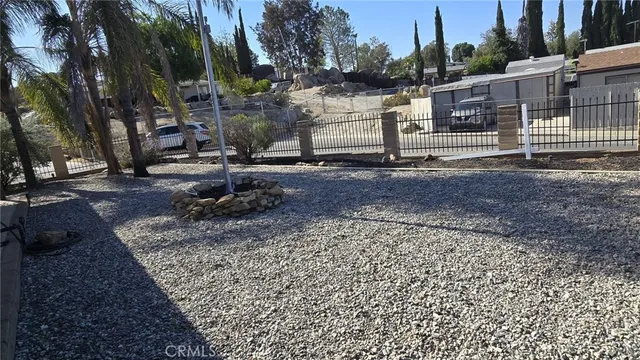 a view of a park with large trees