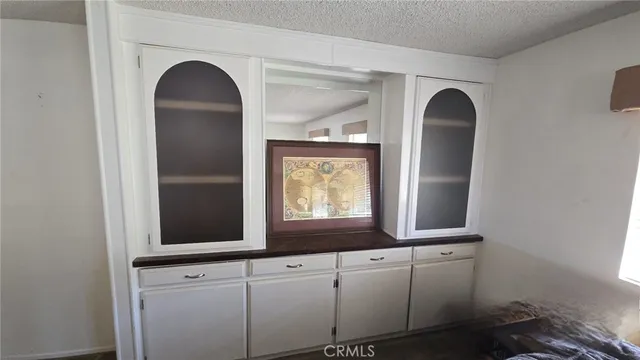 a view of two mirror and cabinets