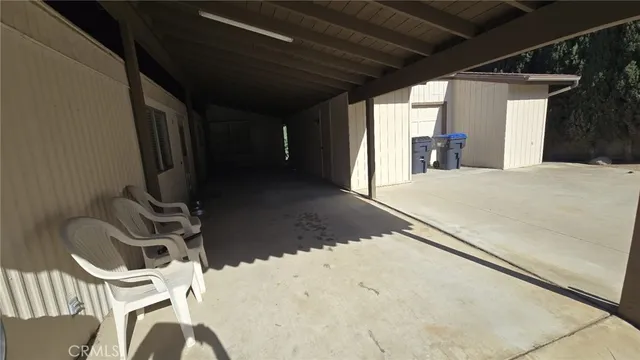 a kitchen with a sink a table and chairs