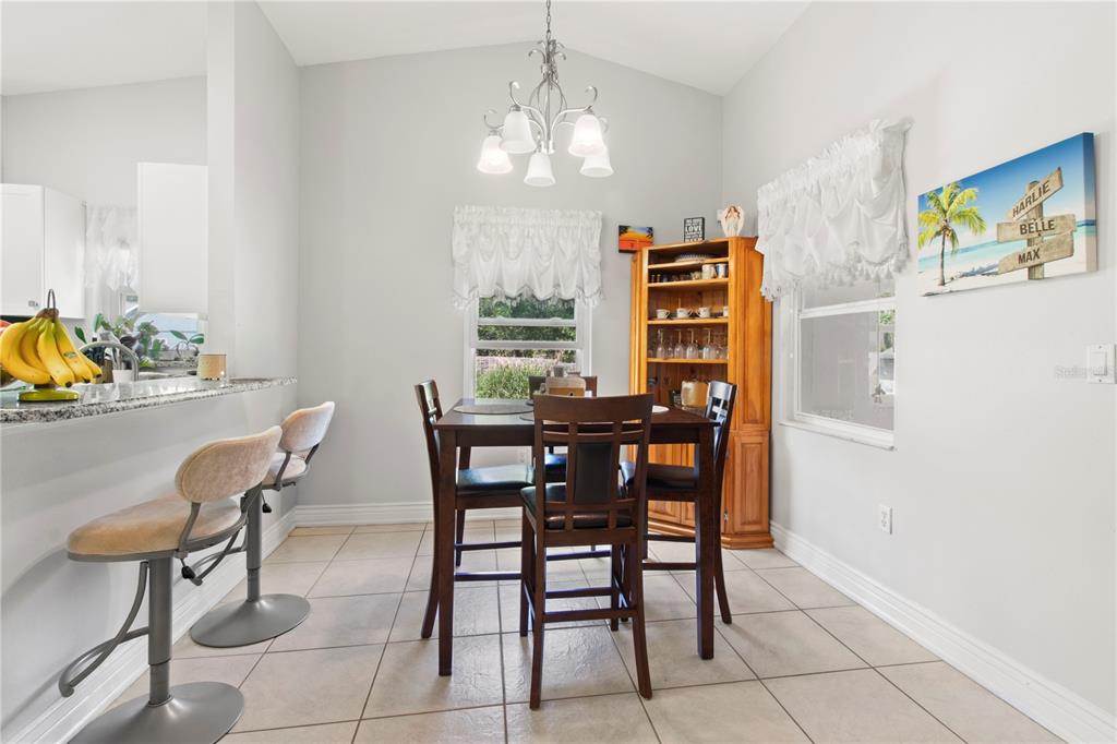 5910 Bella Road Parrish, FL 34219 - Photo 14 of 57 a dining room with furniture and window