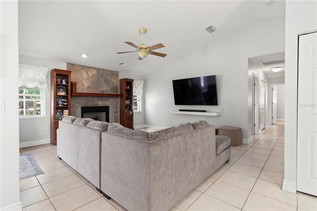 5910 Bella Road Parrish, FL 34219 - Photo 15 of 57 a living room with furniture and a flat screen tv