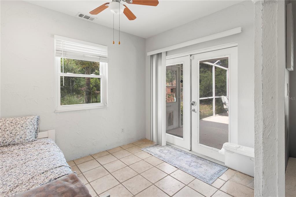 5910 Bella Road Parrish, FL 34219 - Photo 18 of 57 a bedroom with a bed and a window