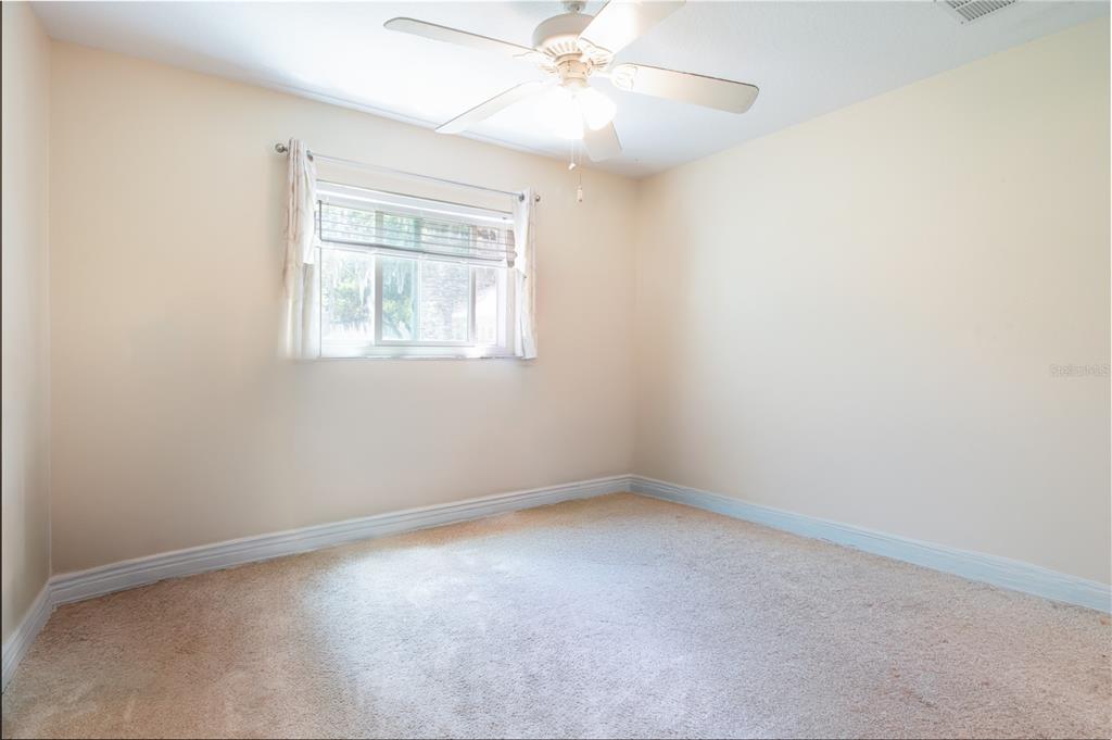 5910 Bella Road Parrish, FL 34219 - Photo 26 of 57 an empty room with a window and a fan