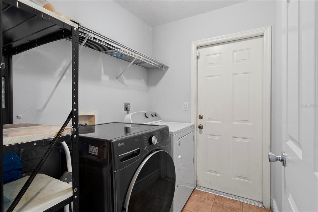 5910 Bella Road Parrish, FL 34219 - Photo 32 of 57 a utility room with dryer and washer