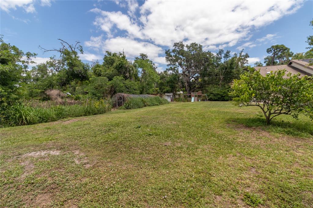 5910 Bella Road Parrish, FL 34219 - Photo 36 of 57 a view of a field with trees in the background