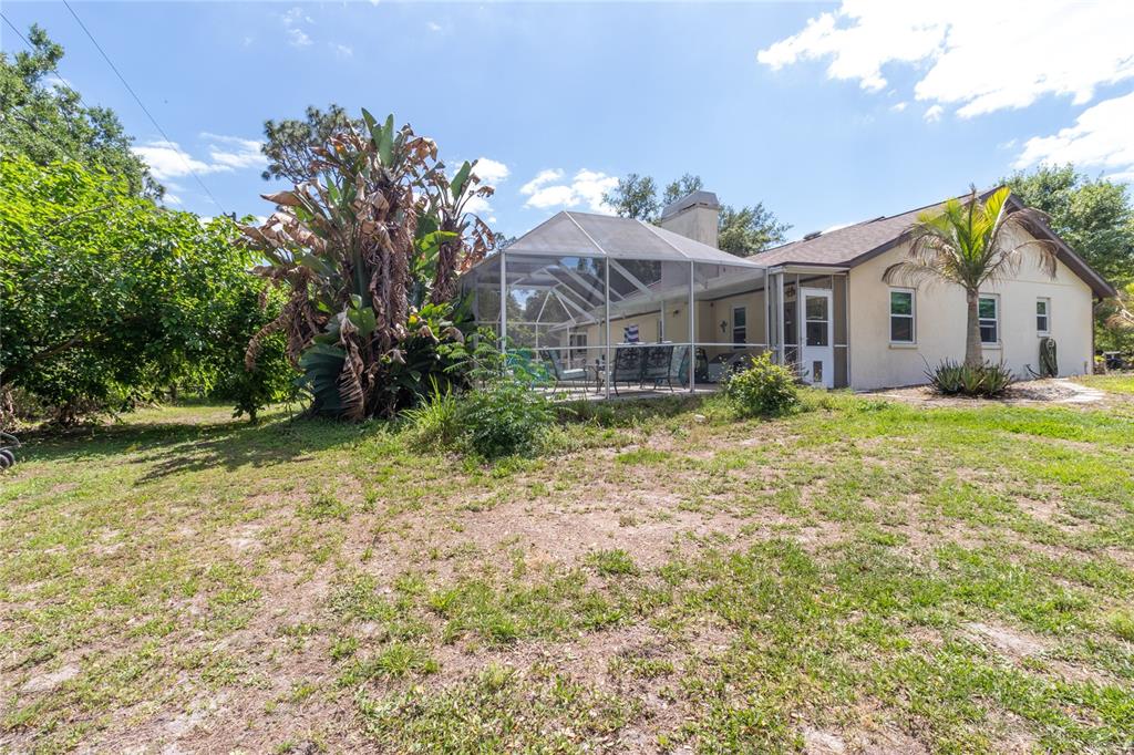 5910 Bella Road Parrish, FL 34219 - Photo 42 of 57 a front view of house with yard and trees around