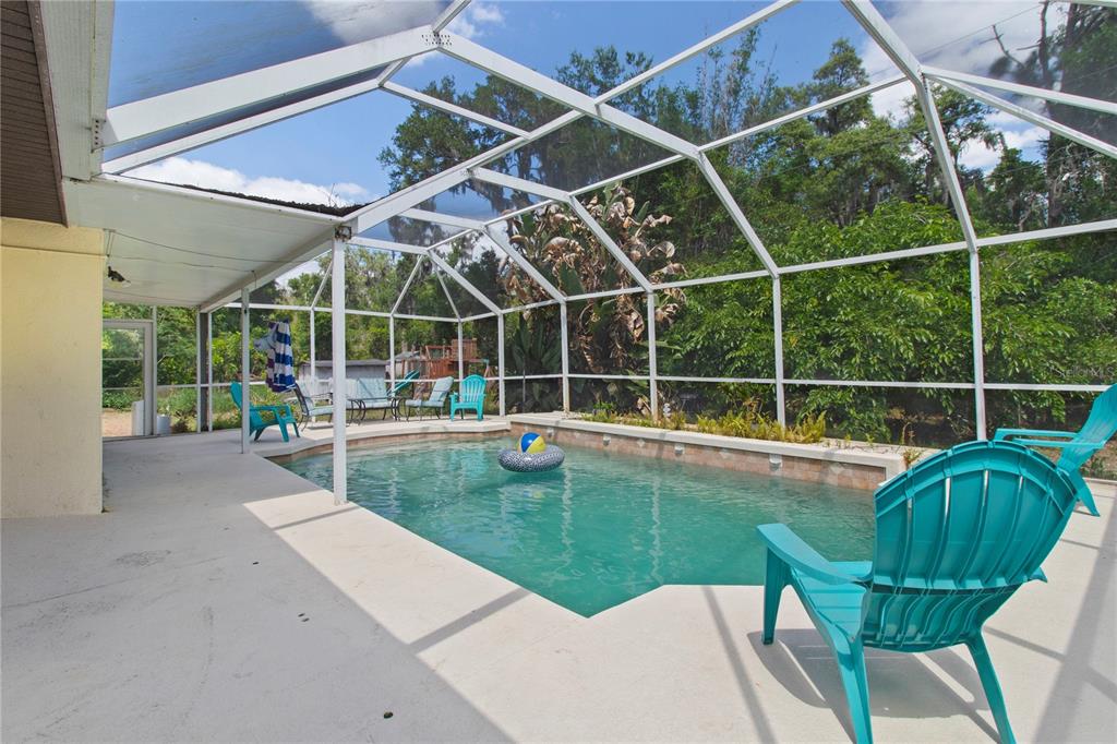 5910 Bella Road Parrish, FL 34219 - Photo 44 of 57 a view of a backyard with sitting area