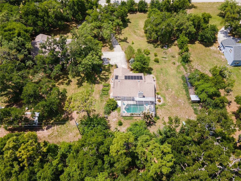5910 Bella Road Parrish, FL 34219 - Photo 46 of 57 an aerial view of residential house with outdoor space and trees all around