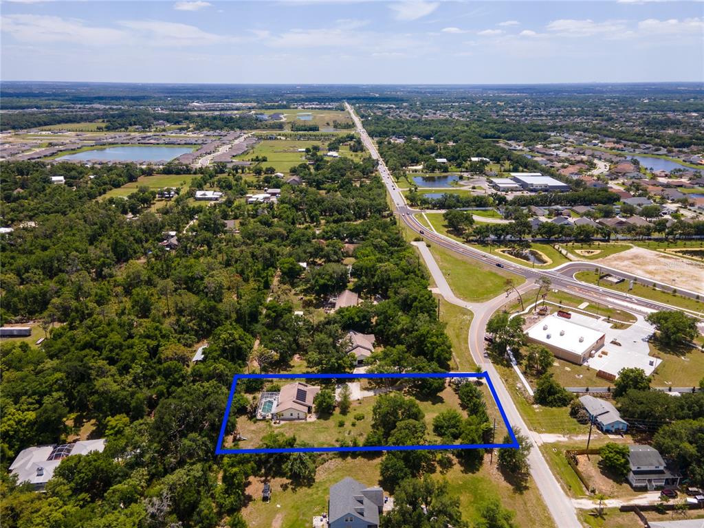5910 Bella Road Parrish, FL 34219 - Photo 51 of 57 an aerial view of residential building and lake