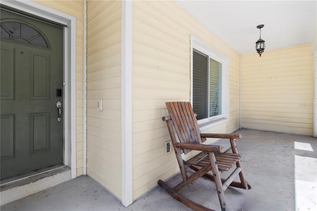 5910 Bella Road Parrish, FL 34219 - Photo 6 of 57 a view of a room that has a wooden bench and chair