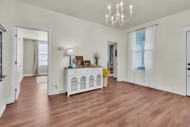 a living room with furniture and a rug
