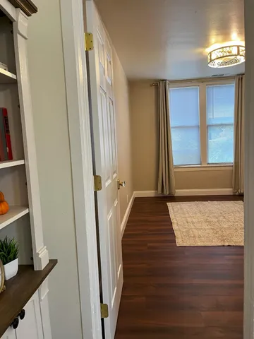 a living room with a rug