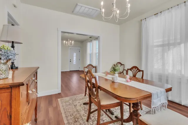 a aerial view of a house with a yard and garden