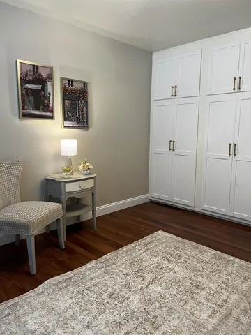 a living room with stainless steel appliances kitchen island granite countertop furniture and a view of kitchen