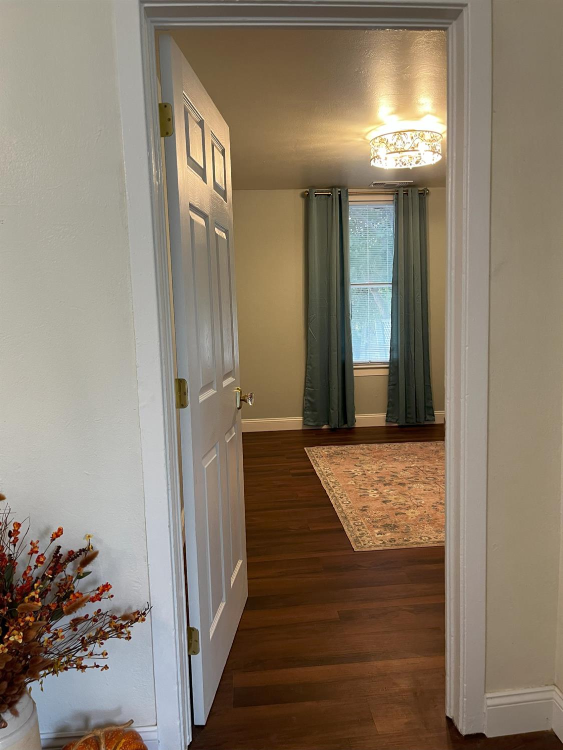 1659 Hazel Street Gridley, CA 95948 - Photo 21 of 70 a view of a hallway with wooden floor and entryway
