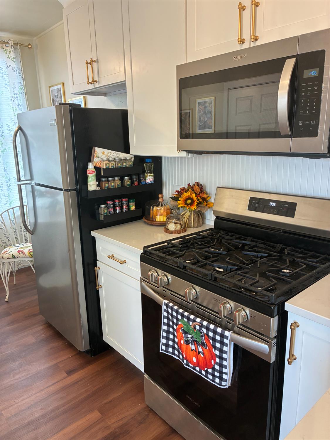 1659 Hazel Street Gridley, CA 95948 - Photo 26 of 70 a kitchen with stainless steel appliances granite countertop a stove a refrigerator and a microwave