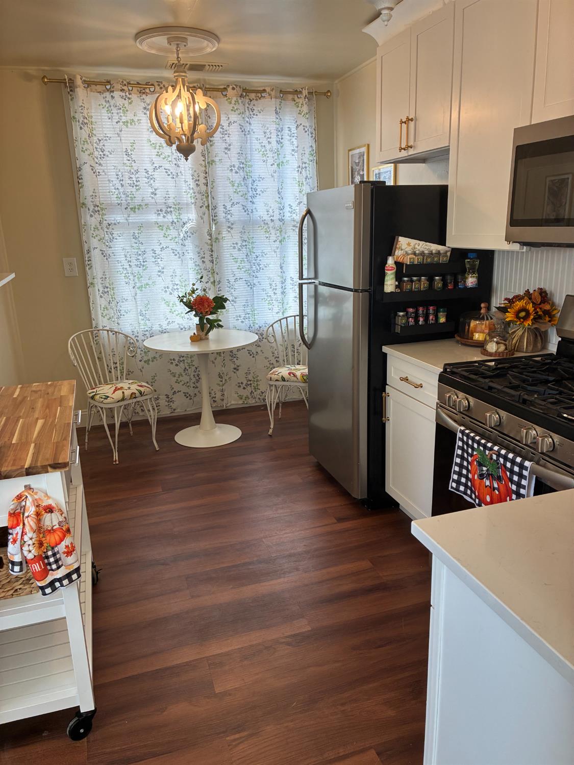 1659 Hazel Street Gridley, CA 95948 - Photo 28 of 70 a kitchen with stainless steel appliances granite countertop a refrigerator a stove and a wooden floors