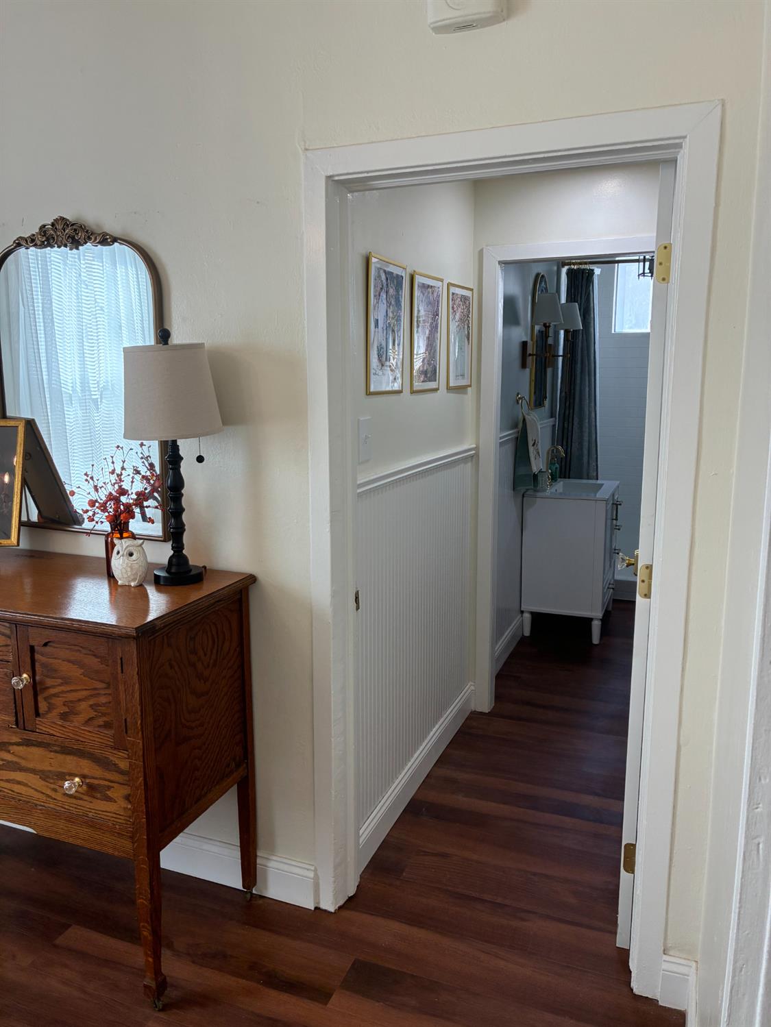 1659 Hazel Street Gridley, CA 95948 - Photo 29 of 70 a view of a hallway with wooden floor windows and a kitchen