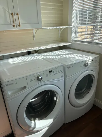 a dining room with furniture and flowers