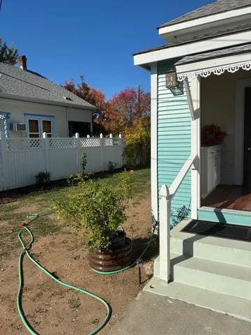 a view of a dining room with furniture and window