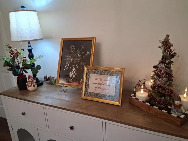 a view of a dining room with furniture wooden floor and chandelier