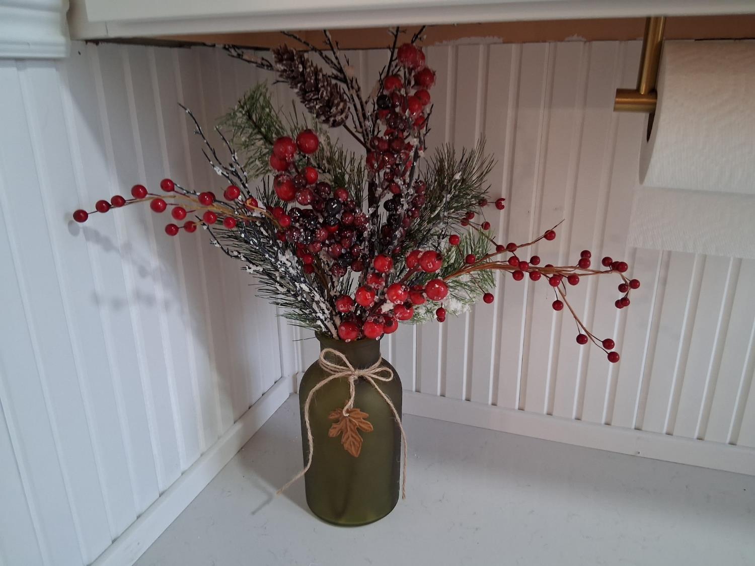 1659 Hazel Street Gridley, CA 95948 - Photo 50 of 70 a vase of flowers sitting on a white cabinet