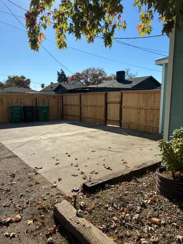 a view of a backyard of the house