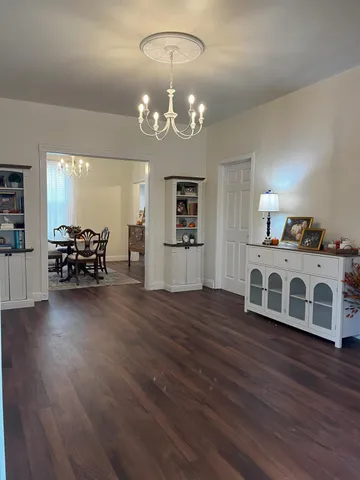 a bathroom with a light fixture and a window